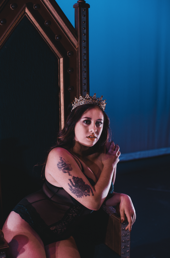 Model Ameyalli Ixtlilxochtil Manon-Ferguson poses for a photo in an bejeweled crown and black sheer bodysuit. 