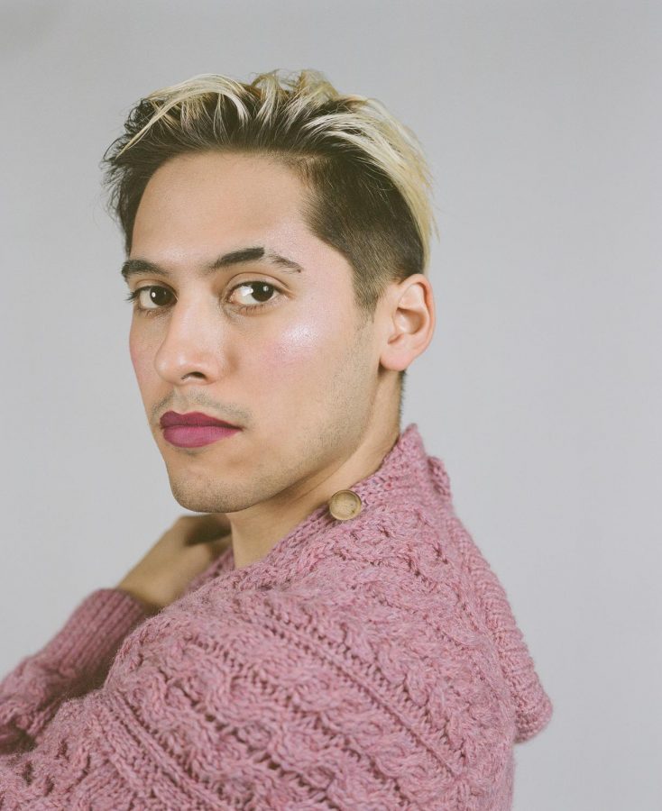Model Luis Acosta wears vintage knit sweater from Beekman Place Antique Mall 
